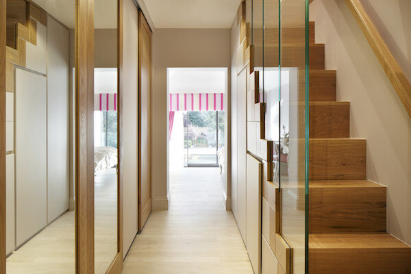Bespoke oak staircase, mirror sliding doors and under-stair storage