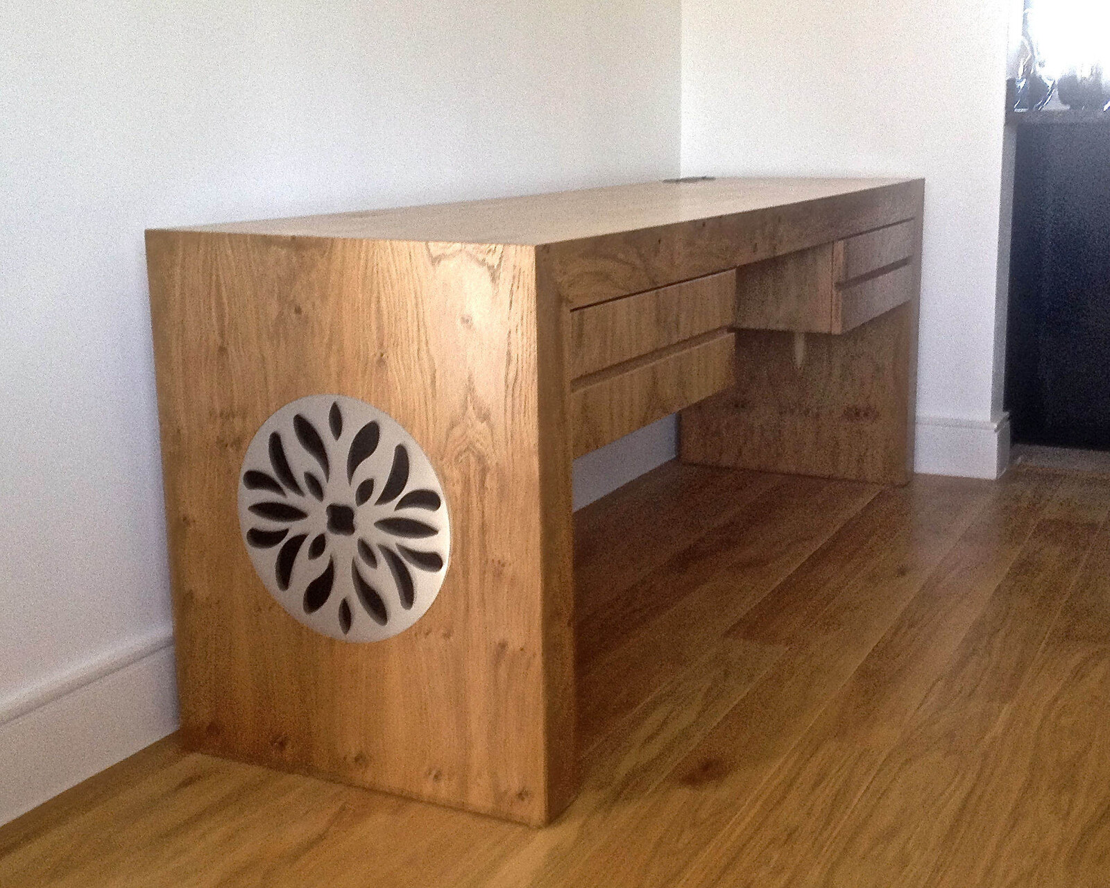 Bespoke oak desk with floral cut-out side panel
