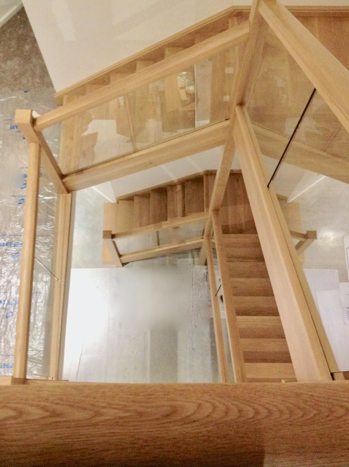 Bespoke light oak staircase with timber-framed glass balustrade
