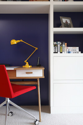 Study detail with yellow lamp and red chair