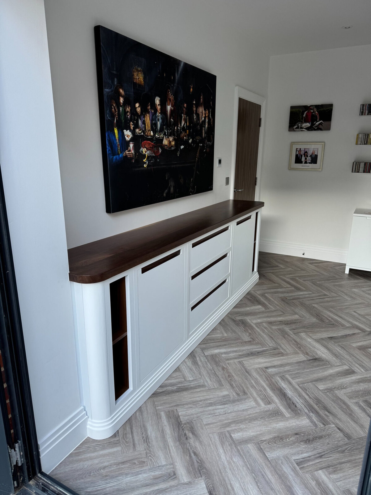 Bespoke desk with walnut top under feature artwork