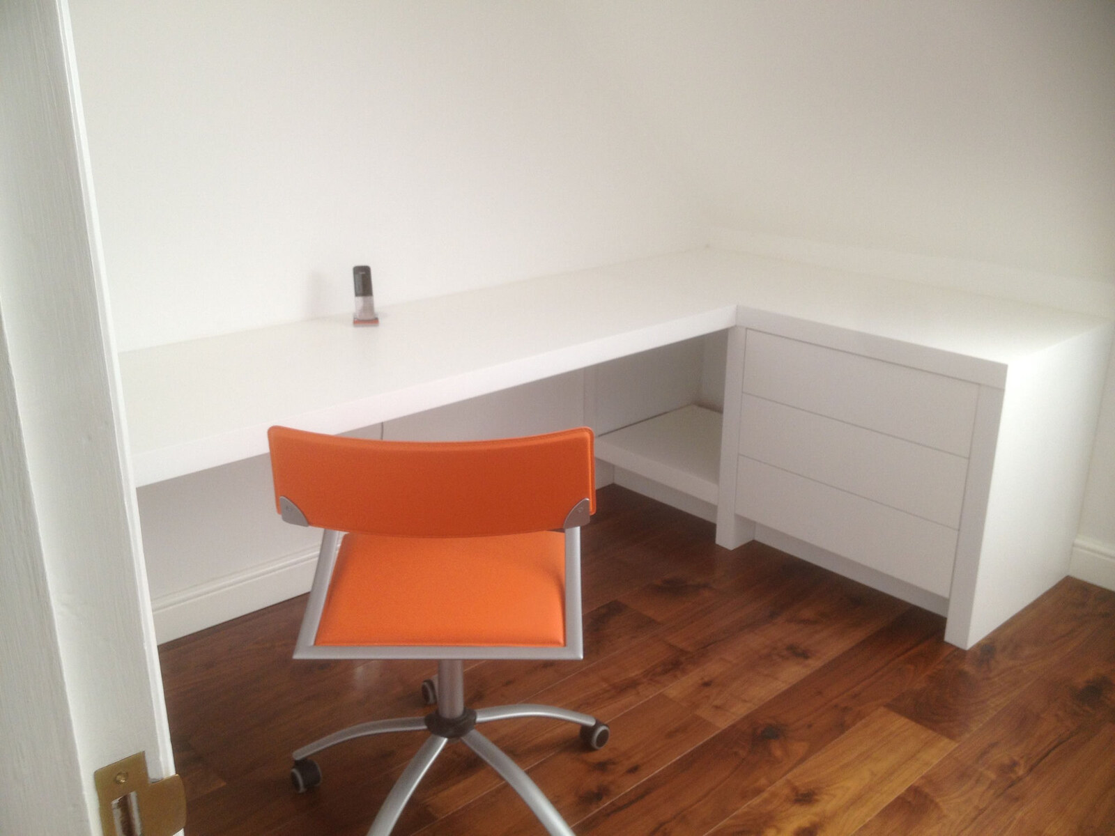 Bespoke white L-shaped corner desk with integrated chest of drawers