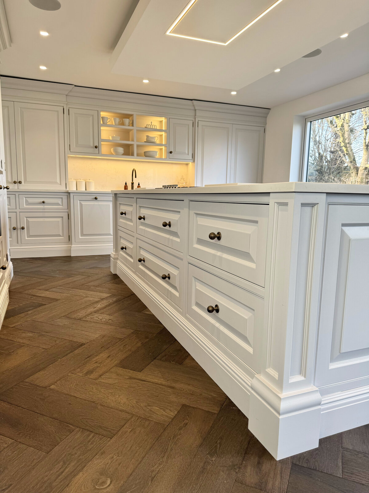 Shaker island drawers with brass cup handles